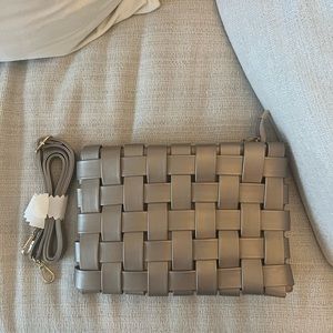 Metallic silver woven Anthropologie purse.